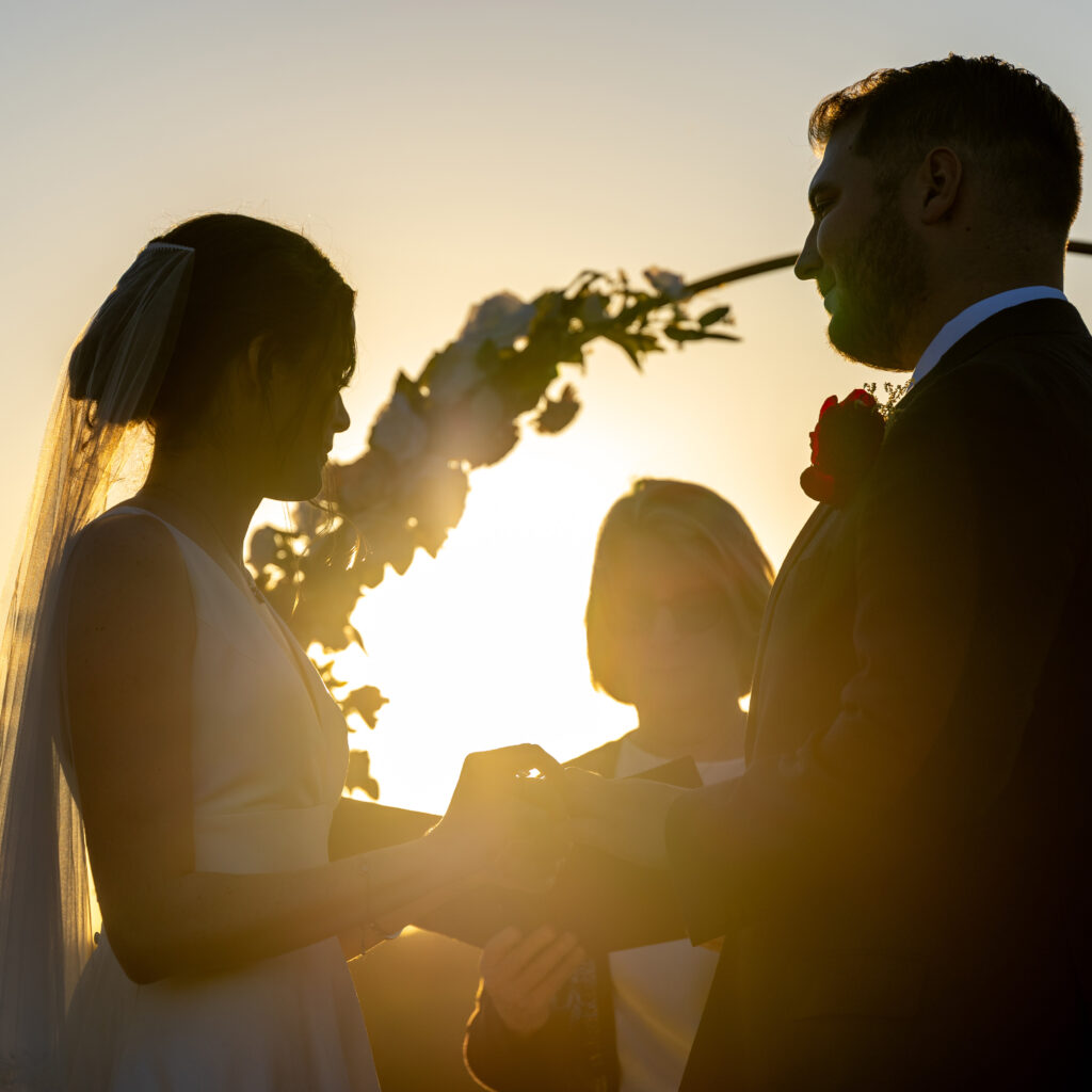 Sunset wedding vows silhouette